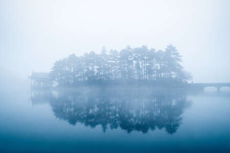 lake in fog, beautiful mount lu scenic area landscape, Chinaの写真素材