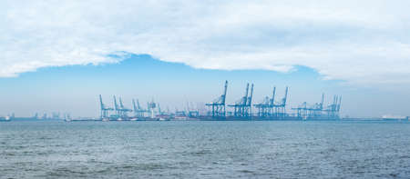 modern container seaport against a blue sky in tianjinの写真素材