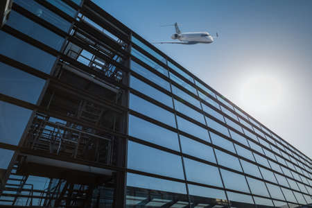 glass building and airplane in modern airportのeditorial素材