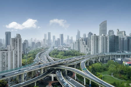 city interchange in shanghai, elevated road junction and bule skyの写真素材