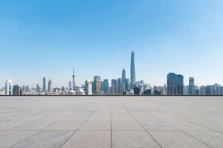 empty brick floor with modern metropolis cityscape in shanghaiの写真素材