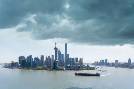 shanghai skyline and the sky clouded over, storm is brewingの写真素材