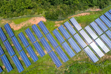 aerial view of photovoltaic panels on hillside , renewable energy for solar power