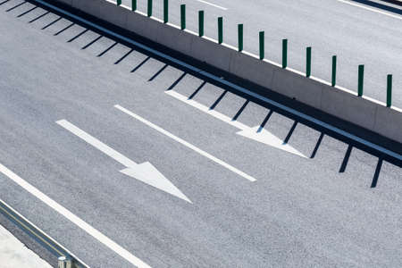 expressway pavement and traffic arrow closeupの写真素材