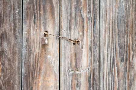 ancient wooden door and old lockの写真素材