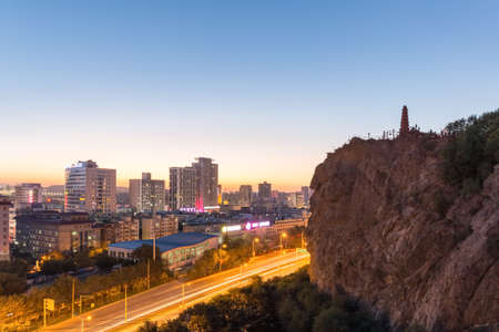 urumqi cityscape in sunset, red hill park, xinjiang, Chinaの写真素材