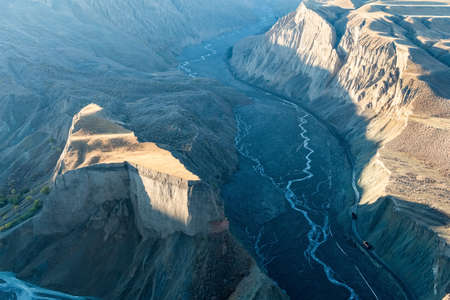 xinjiang anjihai grand canyon closeup, a road for transporting coal at bottom of valleyの写真素材