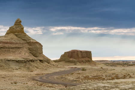 wind erosion landforms landscape at dusk, beautiful world ghost town of karamay, Chinaの写真素材