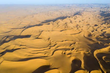 aerial view of desert in sunset, high angle overlooking sand dunesの写真素材