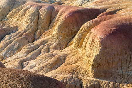 xinjiang colorful beach landform closeup, natural background texture of wind erosion and water...