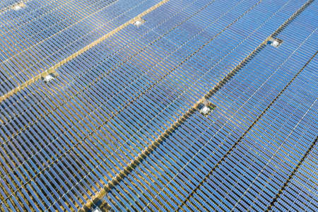 aerial view of photovoltaic power station, arrays of solar panels, renewable energy landscape