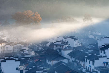 the early morning sun shone on the misty countryside,  shicheng village,  wuyuan county, jiangxi province , Chinaの写真素材