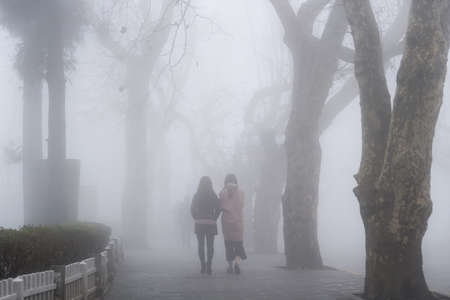cool street in fog at lushan mountain, jiangxi province, Chinaの写真素材