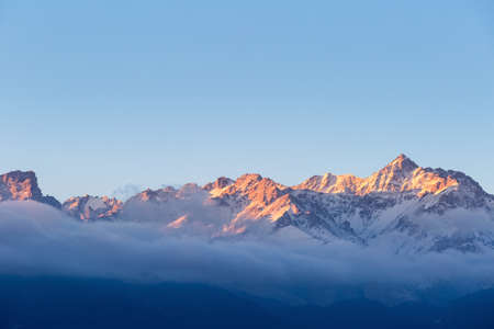 the peak in sunrise,golden sun shines on the top of tianshan mountains