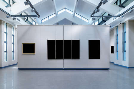 blank picture frames on exhibition wall in a roomのeditorial素材