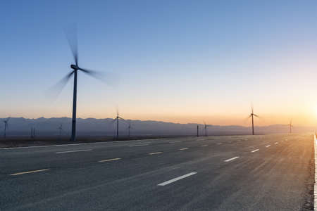 gobi road at dusk and wind farm on chaka salt lake, China