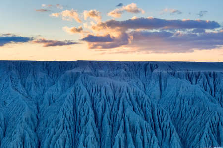 canyon landscape of ravines and gullies criss-cross texture and sunset glow, xinjiangの写真素材