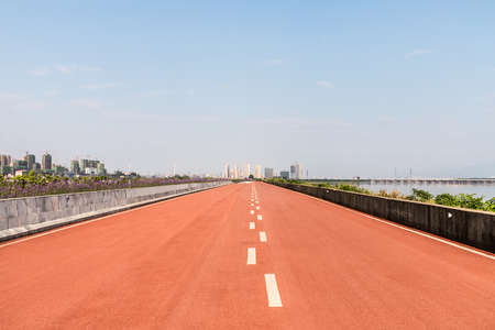 plastic runway by lakeside in cityの写真素材