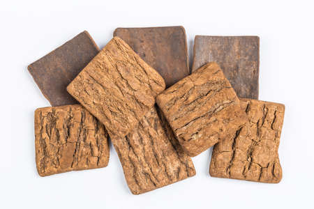 eucommia ulmoides piece isolated on white background, traditional chinese medicine herbs