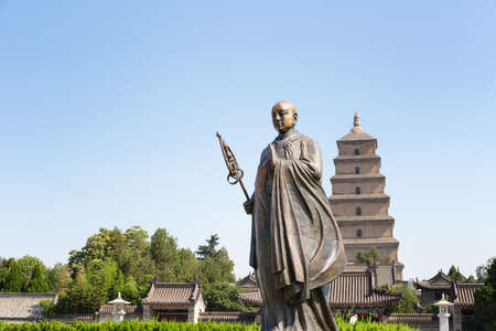 monk xuanzang statue with giant wild goose pagoda in xian,Chinaのeditorial素材