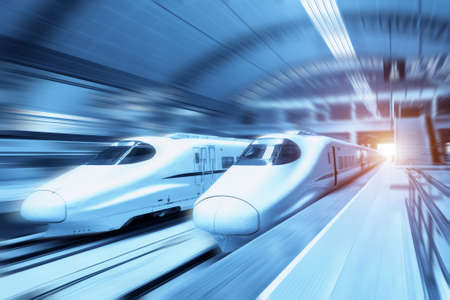 modern trains on railway station with motion blur