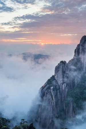 mount sanqing in sunset, unique array granite pillars and peaks, one of the world natural heritage sites, jiangxi province, Chinaの写真素材