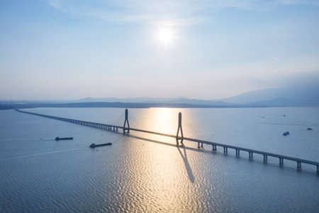 aerial view of poyang lake second bridge at dusk, jiangxi province, Chinaの写真素材