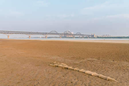 river beach and jiujiang road and railway combined bridge, Chinaの写真素材