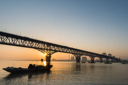 jiujiang highway and railway combined bridge in sunrise, Chinaの写真素材