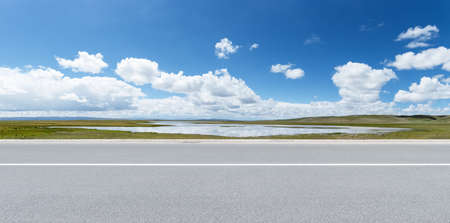 road with sunny sky and beautiful natural landscape, qinghai province, Chinaの写真素材