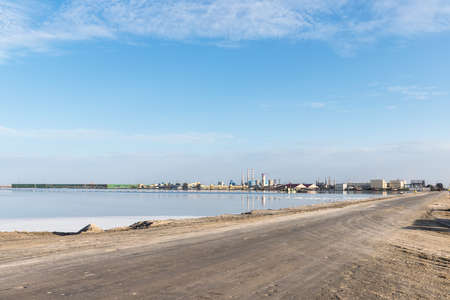 simple road and salt lake potash fertilizer factory, golmud city, qinghai province, Chinaの写真素材