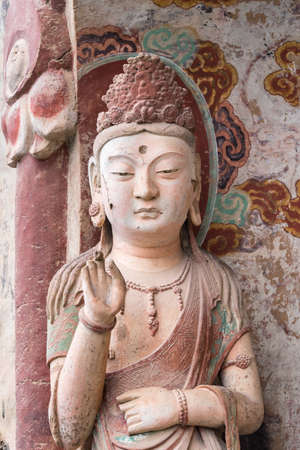 buddhist statue closeup in maiji mountain grottoes in tianshui city, gansu province, China.のeditorial素材