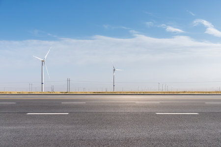 wind farm by the road, renewable energy backgroundの写真素材