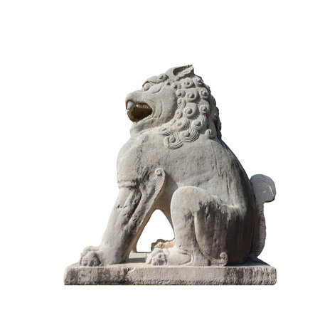 ancient stone carving lion isolated on white with clipping pathの写真素材
