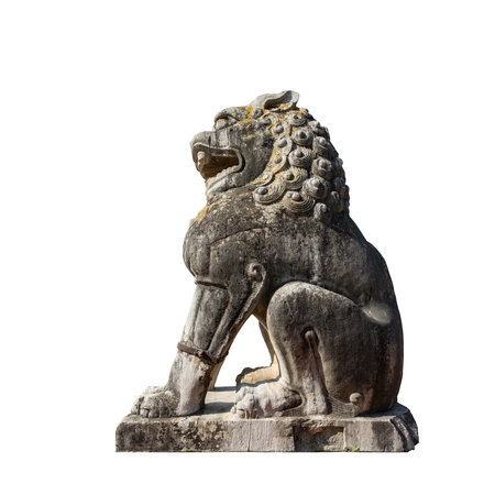 ancient stone carving lion isolated on whiteの写真素材