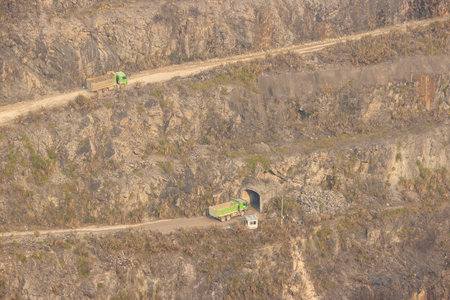 closeup of the iron mine pit, truck drives along a winding path, huangshi national mine park, hubei province, Chinaの写真素材