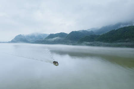 aerial view of beautiful fuchun river with mist rain, hangzhou city, zhejiang province, Chinaの写真素材