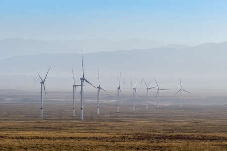 wind power plant on western wilderness, renewable energy source landscapeの写真素材