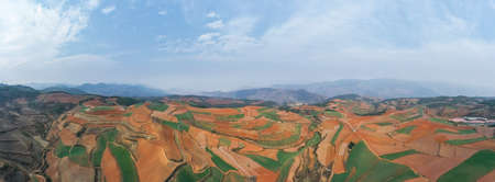 panoramic view of the red land landscape, dongchuan district, kunming city, yunnan province, Chinaの写真素材
