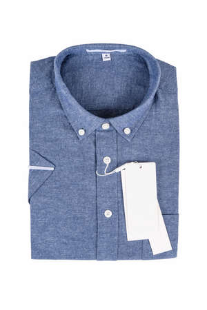 denim blue cotton and linen shirt with blank labels isolated on white backgroundの写真素材