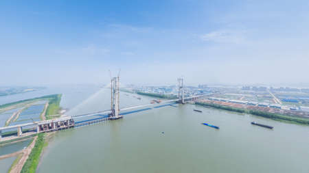 cable-stayed bridge under construction on Yangtze River, high-speed railway bridge, Jiujiang city, Jiangxi province, China.の写真素材