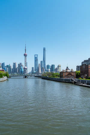 shanghai cityscape from suzhou river against a sunny sky, Chinaの写真素材