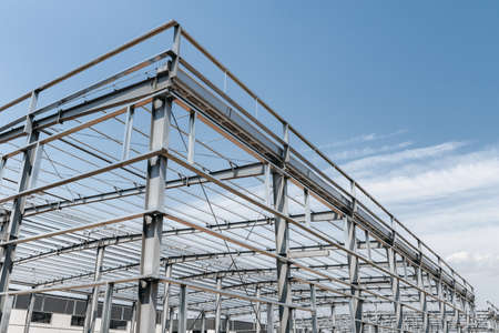 steel structure workshop against a blue skyの写真素材