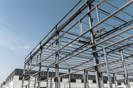 steel structure workshop against a blue skyの写真素材