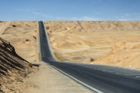undulating road in desert wilderness, Qinghai province, Chinaの写真素材