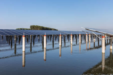solar panels on the fishpond, development of clean energy in the countrysideの写真素材