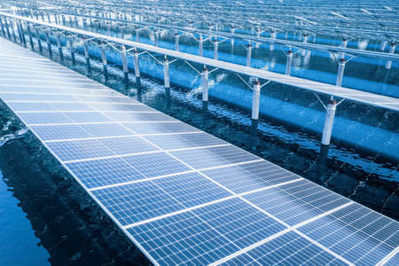 photovoltaic power station closeup on water, blue clean energy landscapeの写真素材