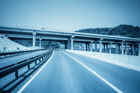 ramp road under expressway with blue toneの写真素材