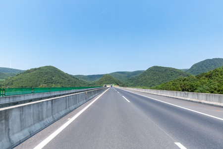 road leading into the tunnel, highway backgroundの写真素材