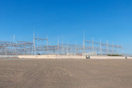 transformer substation on wilderness against a blue skyの写真素材